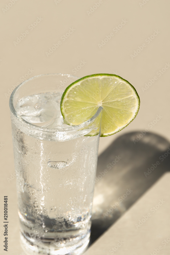 Glass of drinking water with slice of lime Glass of drinking water with slice of lime