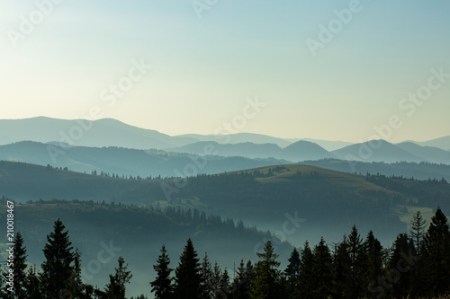 Beautiful early morning with fog between mountains