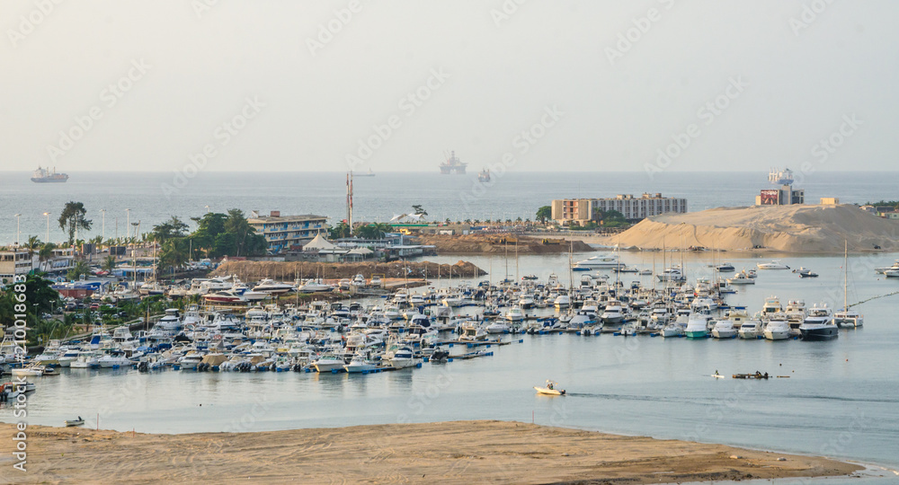 Luanda Yacht Club or Clube Naval de Luanda with many boats at Luanda Bay in the capital of Angola, Africa