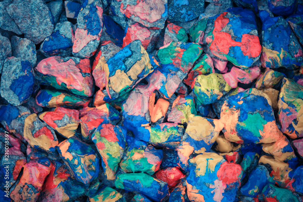 Pebbles painted colored paints in bright spots Pebbles painted colored paints in bright spots