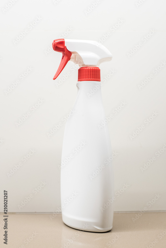 Bottle with white sprinkler without label Bottle with white sprinkler without label