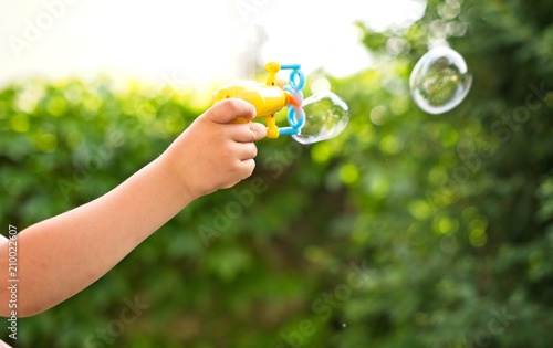 Blowing soap bubbles. Outdoors