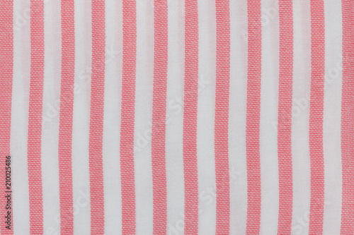 Pink and white striped seamless fabric. Close up