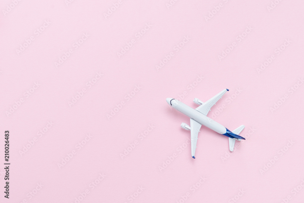 Travel concept. Airplane on a pink background. Place for text. Travel concept. Airplane on a pink background. Place for text.