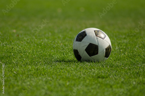 Soccer classic ball on the green grass © katspi