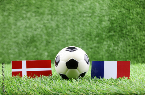 ball with Denmark VS France flag match on Green grass football 2018
