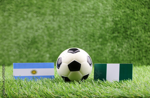 ball with Argentina VS Nigeria flag match on Green grass football 2018