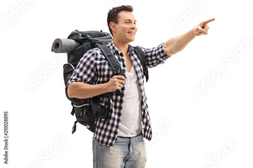 Hiker with a backpack pointing © Ljupco Smokovski