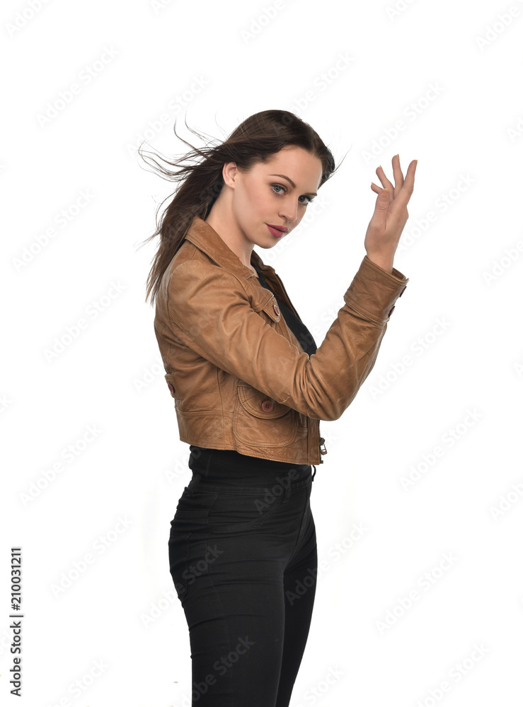 portrait of brunette girl wearing brown leather jacket. white studio background portrait of brunette girl wearing brown leather jacket. white studio background