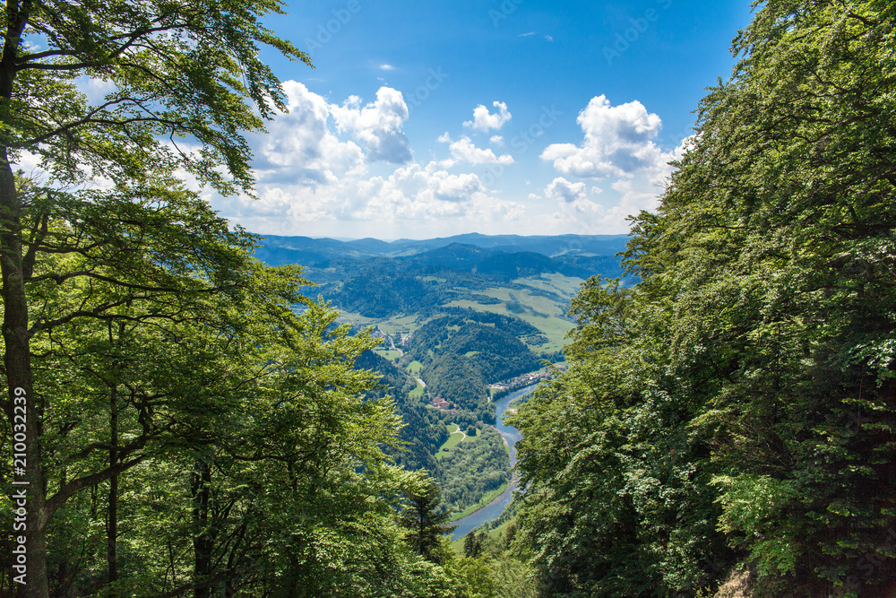 View from the top of the mountain to the Sromowce village by the river. Bialy Dunajec in Pieniny, view from the top of the Three Crowns. The highest peak of the Pieniny, Trzy Korony.