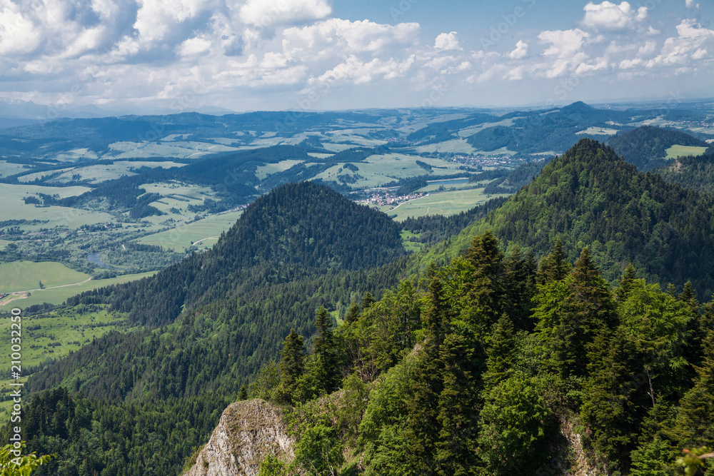 Naklejka premium View from the top of the mountain to the Sromowce village by the river. Bialy Dunajec in Pieniny, view from the top of the Three Crowns. The highest peak of the Pieniny, Trzy Korony.