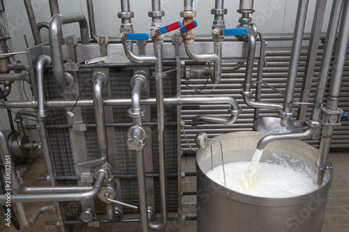 Foto Process Of Filling The Milk Storage Tank  In Modern Dairy