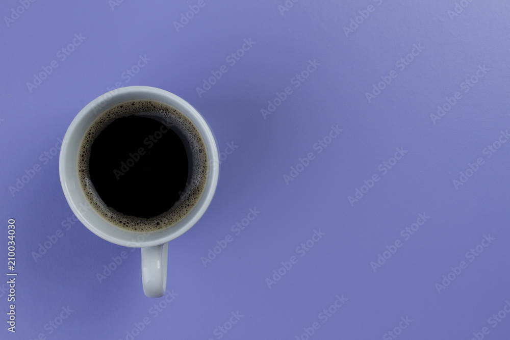 cup of coffee with foam on purple background cup of coffee with foam on purple background