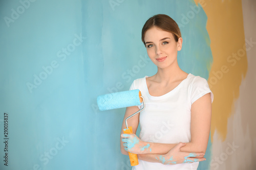 Young female painter with r...