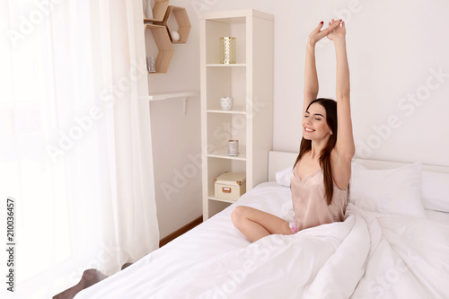 Wallpaper Mural Morning of beautiful young woman in bedroom Torontodigital.ca