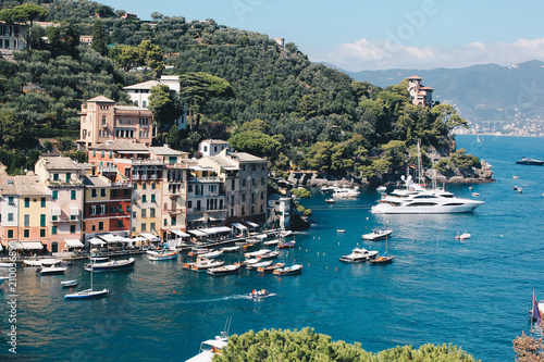 Stunning view in Portofino in Italy with some villas and boats - Travel destination in italy