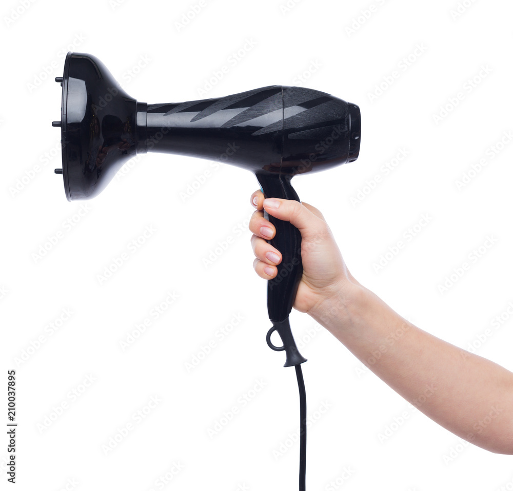 Woman hand holding a hair dryer Woman hand holding a hair dryer