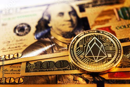 Golden EOS.IO and US dollar banknote. Digital cryptocurrency concept