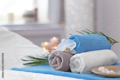 Fototapeta Naklejka Na Ścianę i Meble -  Beautiful spa composition on massage table in wellness center