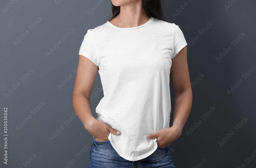 Young woman in white t-shirt on color background. Mockup for design - obrazy, fototapety, plakaty 