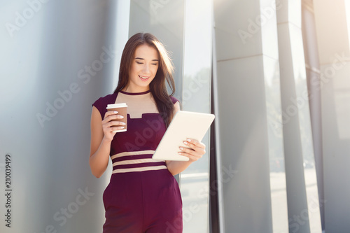Portrait of a confident young businesswoman with digital tablet