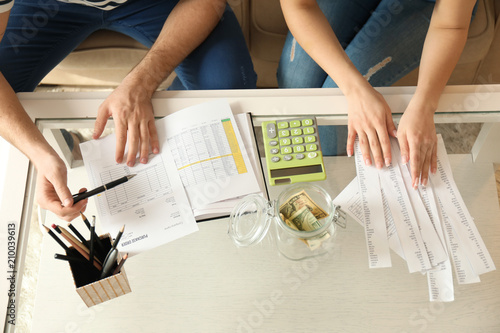 Couple with pay bills, calc...