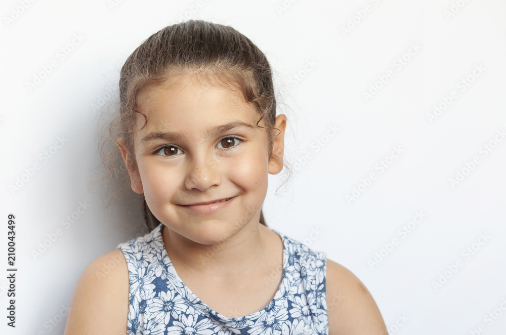 Portrait of a happy laughing child girl. Smiling child. Expressive facial expressions. Portrait of a happy laughing child girl. Smiling child. Expressive facial expressions.