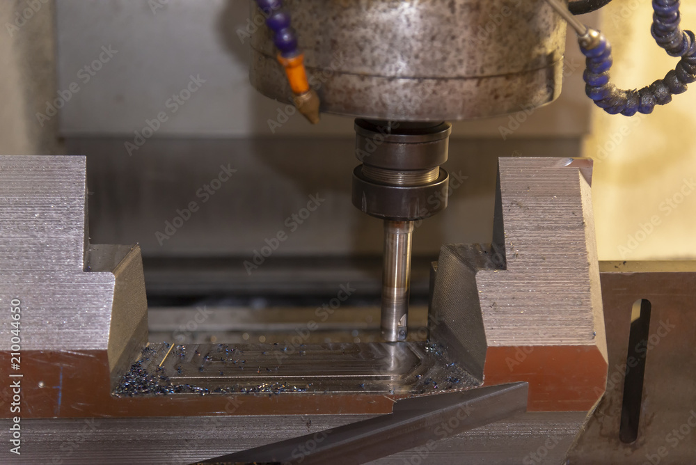The CNC milling machine cutting the tire mold part with the solid ball end-mill tool. The CNC milling machine cutting the tire mold part with the solid ball end-mill tool.