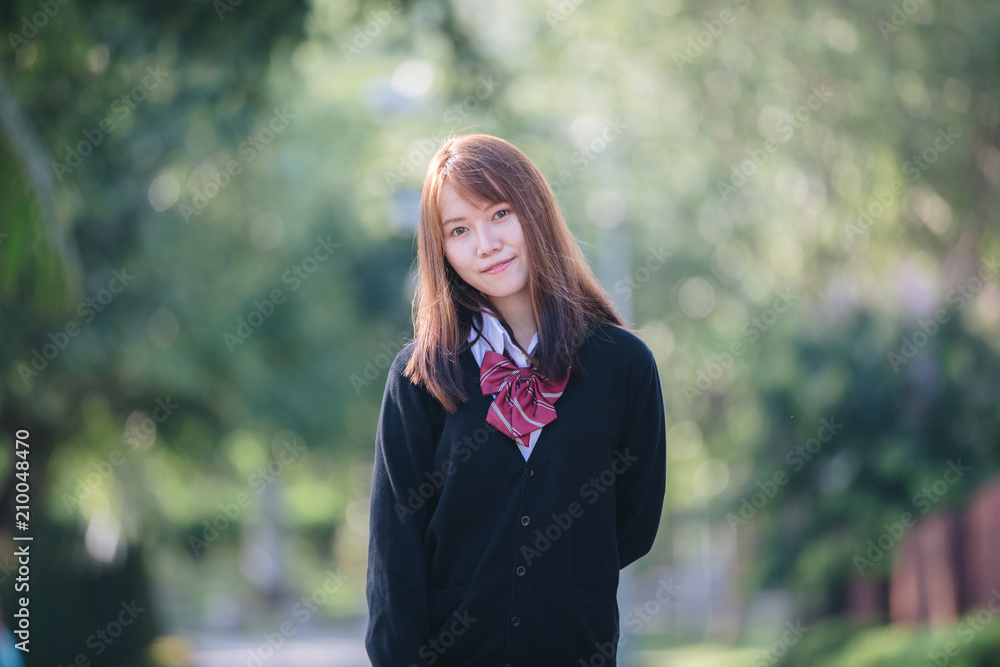 Portrait of asian japanese school girl costume looking at park outdoor film vintage style Portrait of asian japanese school girl costume looking at park outdoor film vintage style
