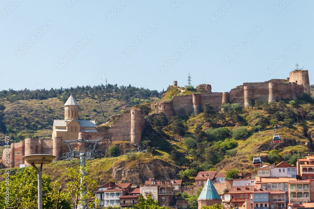 Naklejka premium View on impregnable ancient fortress Narikala and church of St. Nicholas in Tbilisi, Georgia