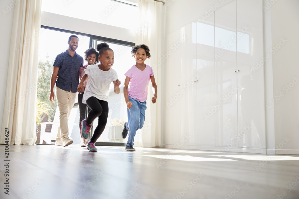 Fototapeta premium Excited Family Exploring New Home On Moving Day
