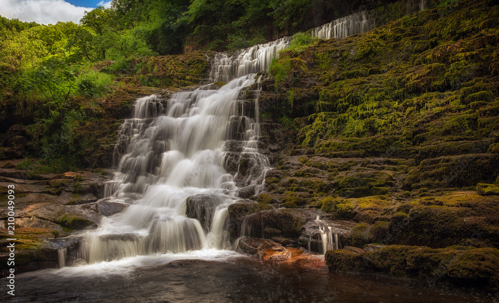 Fototapeta premium Sgwd Isaf Clun-gwyn top section The top section of Sgwd Clun Gwyn waterfall from the west bank, on the Mellte river, near Pontneddfechan in South Wales, UK.