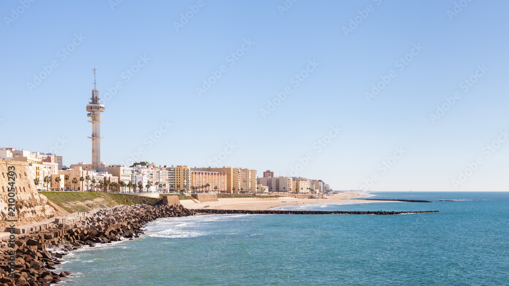 Playa Santa Maria del Mar.  A view of the Cadiz waterfront in Spain and the view along Playa Santa Maria del Mar.