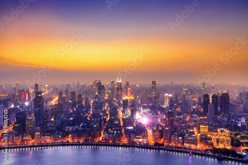 Shanghai cityscape sunset twilight with smog lies over the skyline of Historical architecture and modern skyscraper on the bund of Shanghai, China