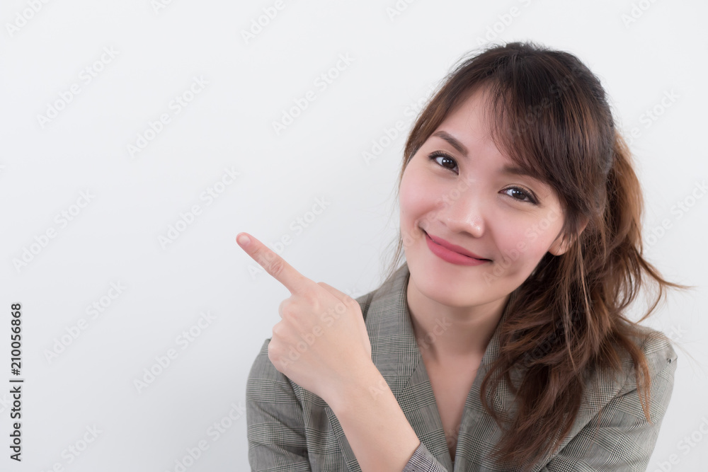 happy girl pointing up; portrait of cheerful smiling woman points hand and finger up to something; positive relaxed happy asian woman smiles in outdoor city scene; asian chinese woman adult model happy girl pointing up; portrait of cheerful smiling woman points hand and finger up to something; positive relaxed happy asian woman smiles in outdoor city scene; asian chinese woman adult model