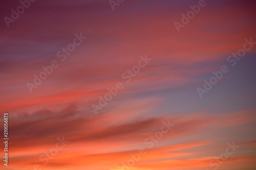 Bright crimson sunset on a summer evening, colorful natural background