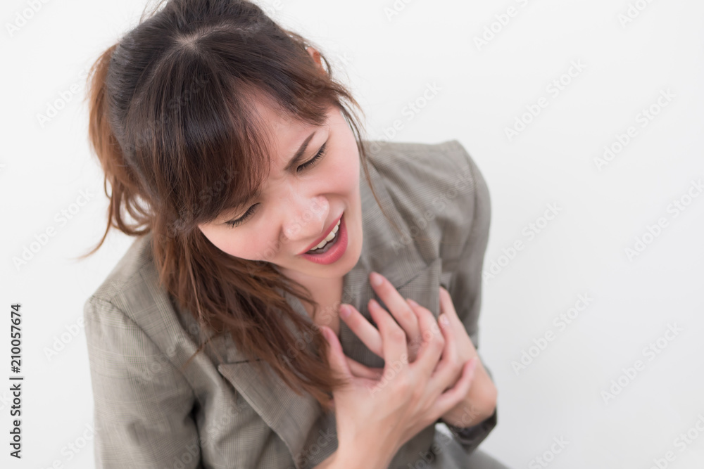 woman with sudden heart attack; sick woman suffering from acute heart attack, concept of emergency health care; asian young adult woman model woman with sudden heart attack; sick woman suffering from acute heart attack, concept of emergency health care; asian young adult woman model