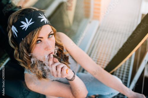 Woman smoking a cannabis joint