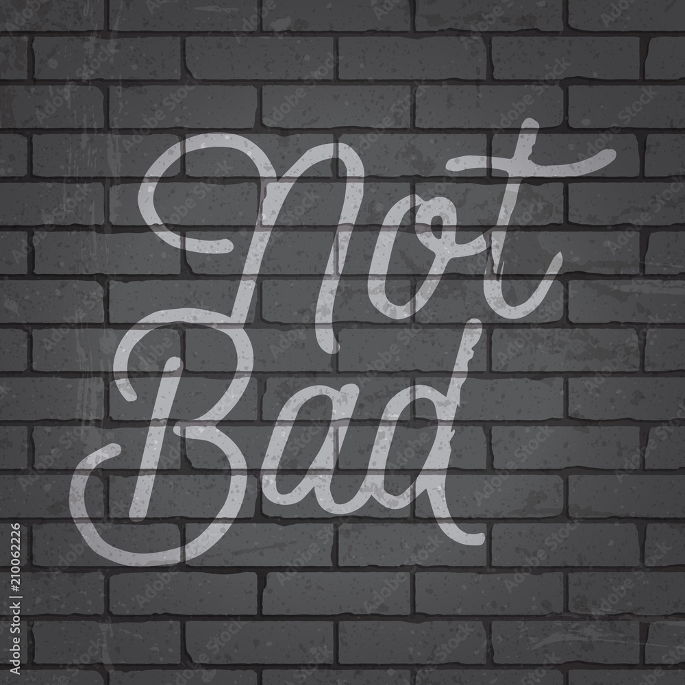 Obraz premium Hand drawn lettering slogan on brick wall background