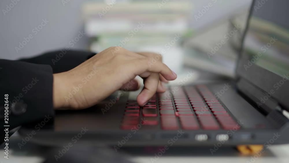 Close-up of hands typing on laptop keyboard Close-up of hands typing on laptop keyboard