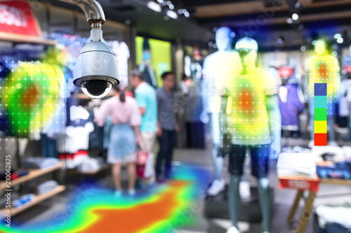 Heatmap Analytic in smart fashion retail shop technology concept. Artificial intelligence cctv of security camera with heat sense application check shoppers passed from any point in store. photo