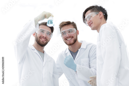 happy scientists look at the result of their work