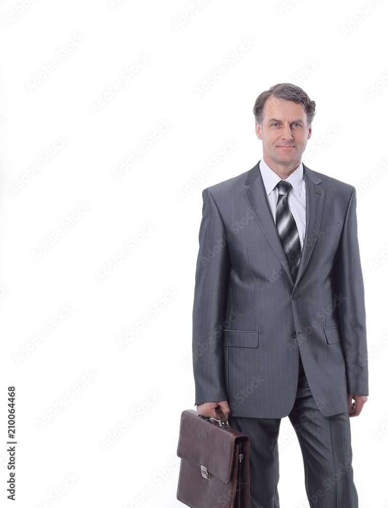 in all growth.Serious man in suit holding jacket in all growth.Serious man in suit holding jacket