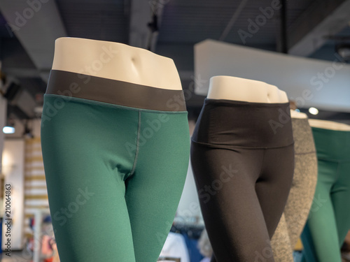 Plastic athletic mannequin lower bodies posing with yoga pants