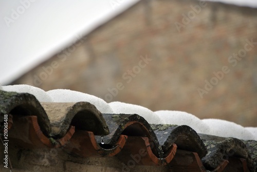 old roof tiles with snow