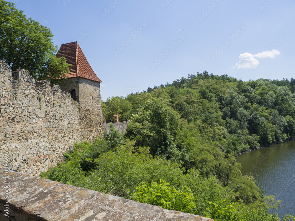 view from rampart of medieval castle Zvikov (Klingenberg), wall with tower, vltava river, spring green trees and blue sky, Czech Republic view from rampart of medieval castle Zvikov (Klingenberg), wall with tower, vltava river, spring green trees and blue sky, Czech Republic