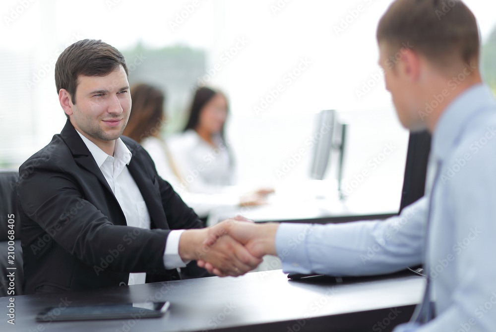 handshake business partners at your Desk handshake business partners at your Desk