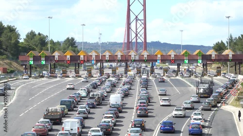 Cars passing through the point of toll highway, toll station near the bridge. Lisbon, portugal