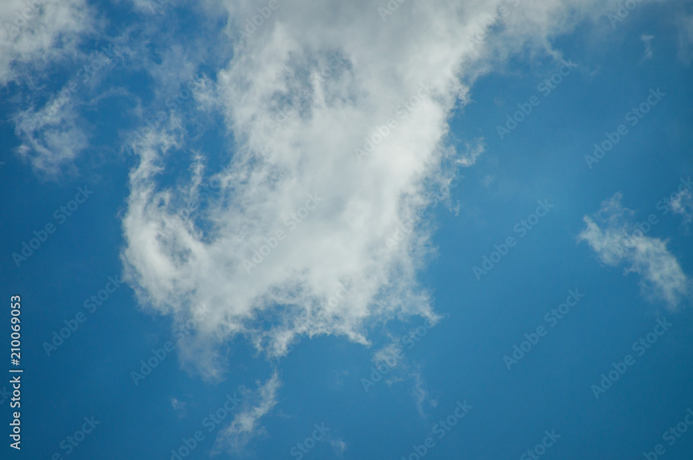 Obraz premium A blue day sky with rare beautiful clouds for the designer's background