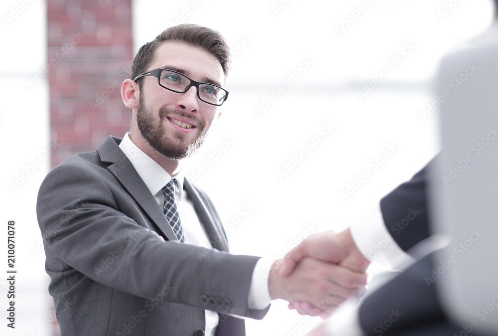 Two business colleagues shaking hands during meeting. Two business colleagues shaking hands during meeting.